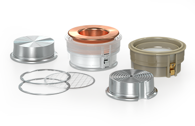 Disassembled metal mechanical seal components arranged on a gray surface, including copper-toned ring, housings, clamps, and retaining rings.